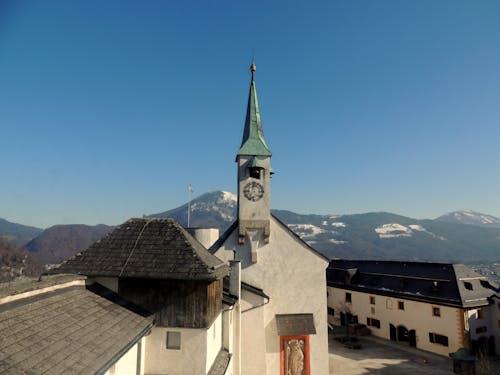 Photo of a Town with a Church against the Sky