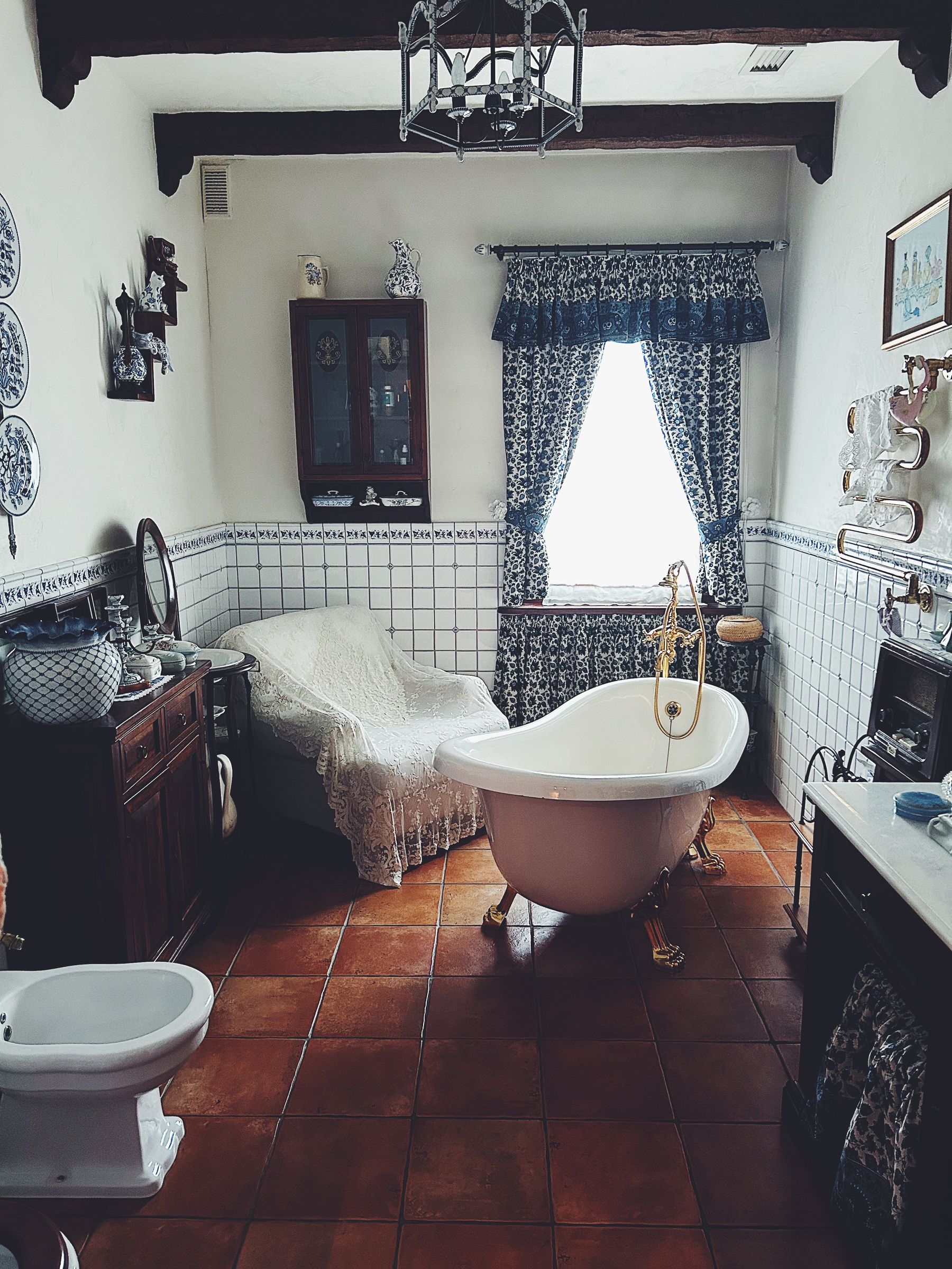 Classic bathroom with bathtub positioned near a tall window