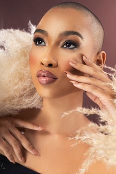 Close-up portrait of a woman with elegant makeup and fashion styling, exuding confidence.