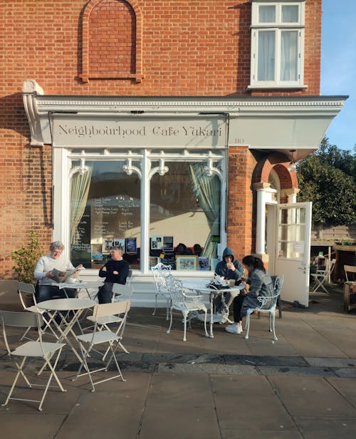 People Sitting in Sidewalk Cafe