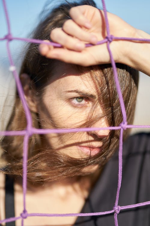 Woman Holding Purple Screen