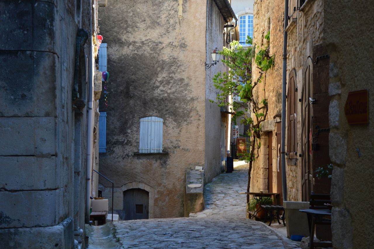 discover a charming narrow cobblestone alleyway in an old european tow