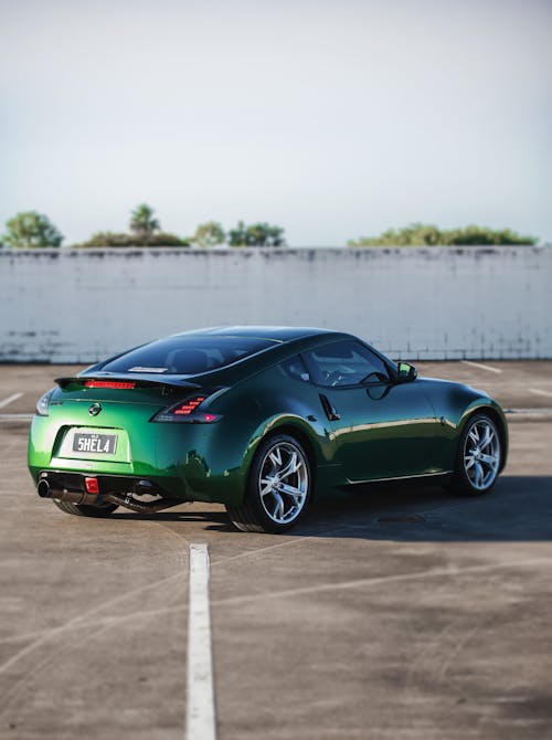 Free View of a Green Nissan 370Z on a Parking Lot  Stock Photo