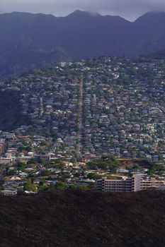 Photo by Cyrill A breathtaking aerial view of Honolulu, capturing the city's urban landscape and mountain backdrop.