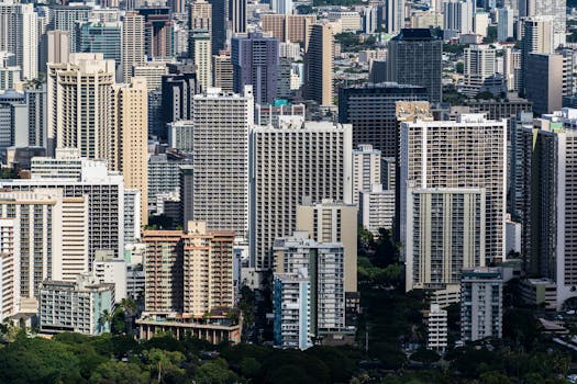 Photo by Cyrill Aerial cityscape of modern skyscrapers in downtown Honolulu on a sunny day.