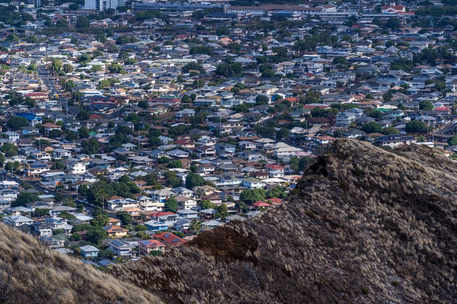 Photo by Cyrill Aerial perspective of Honolulu's residential neighborhood, showcasing urban landscape.