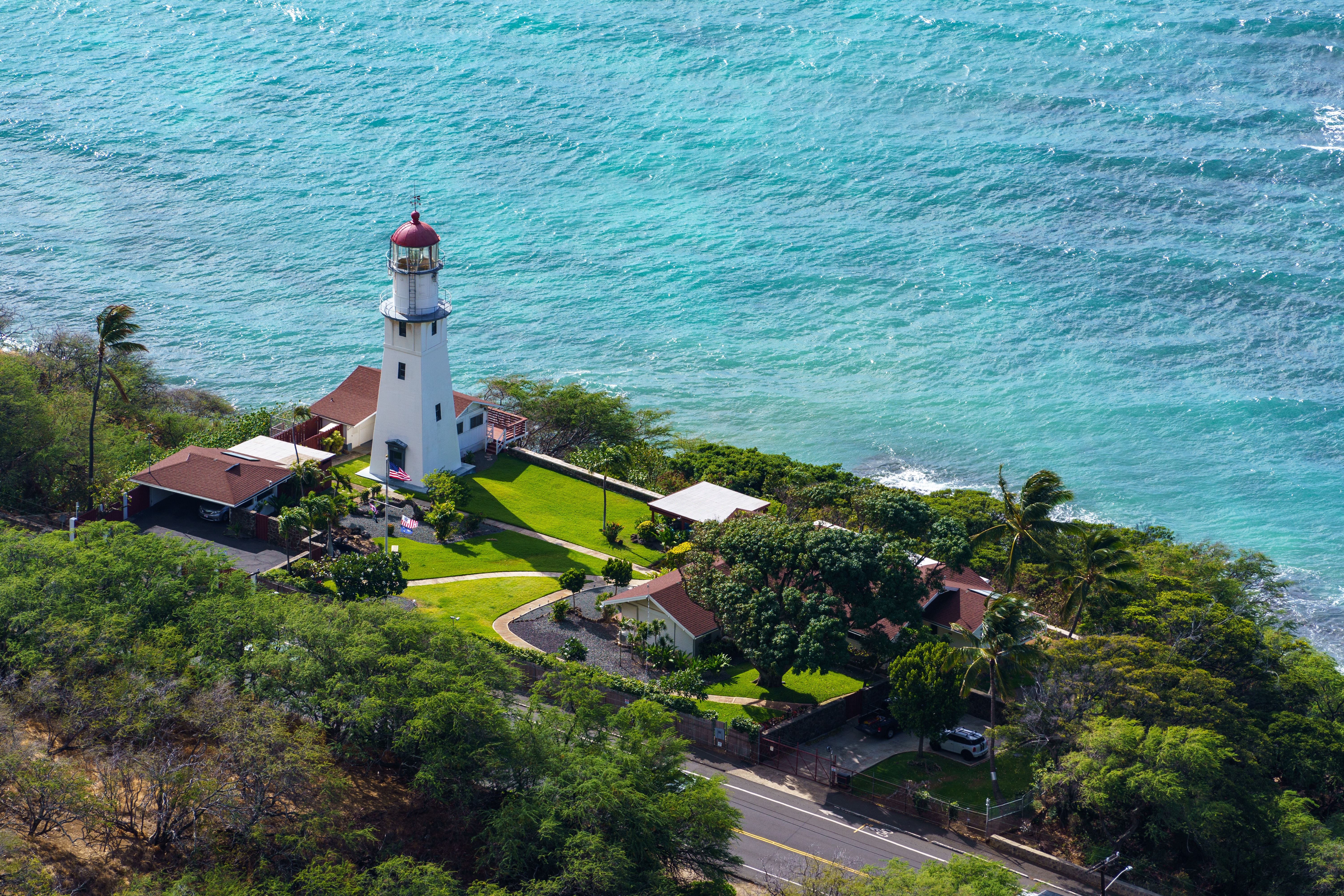Stunning aerial view of Diamond Head Lighthouse by the Pacific Ocean in Hawaii, USA.