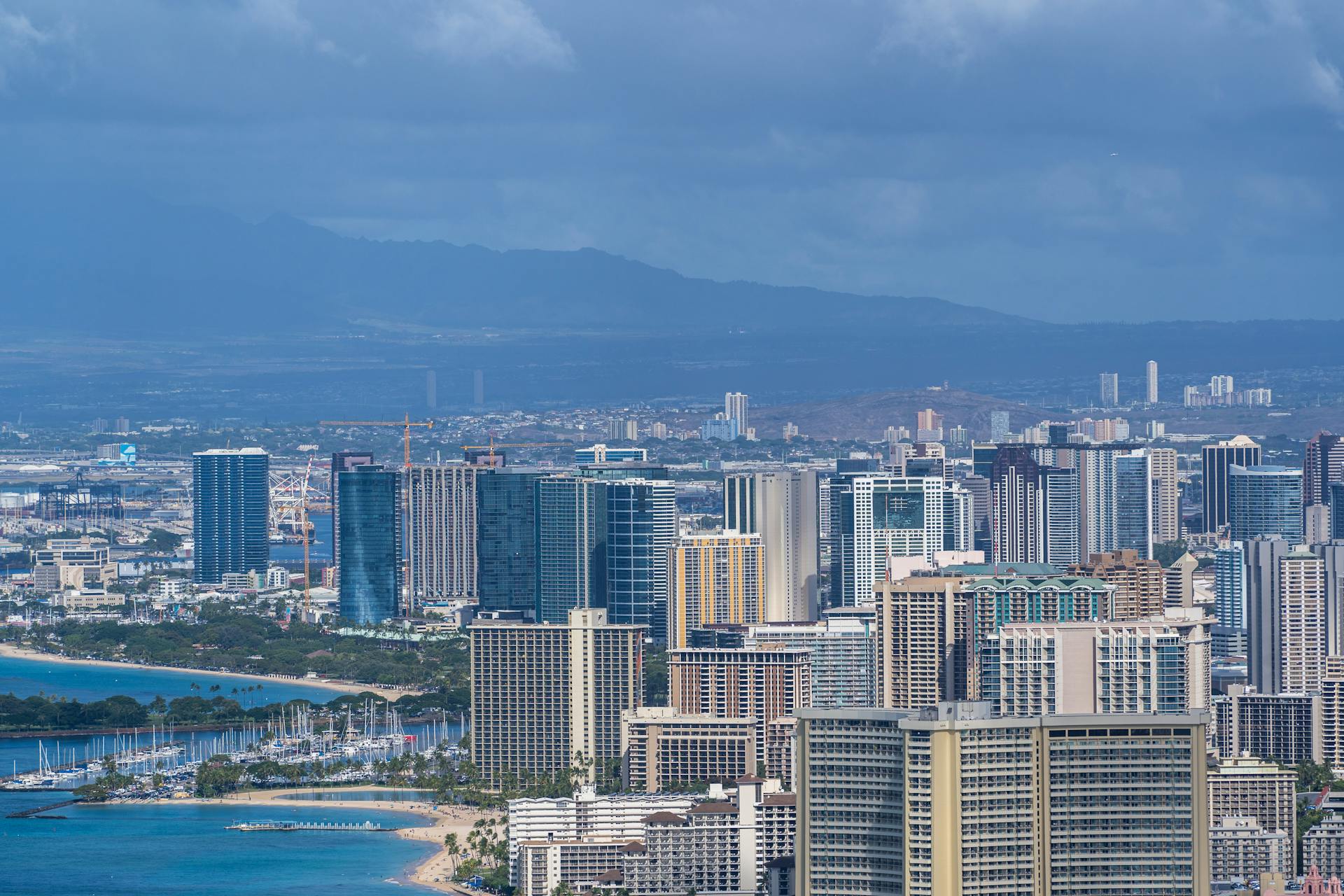 Breathtaking aerial view of downtown Honolulu, Hawaii with skyscrapers and beautiful coastline.