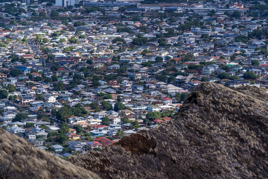 Photo by Cyrill A stunning aerial view of a residential district in Honolulu, showcasing urban density and architecture.