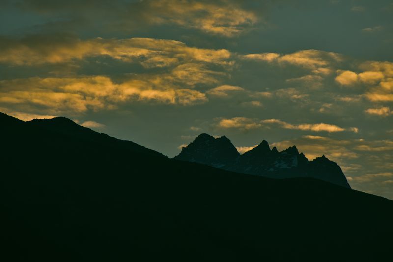 Jagged mountain silhouettes against a dusk sky — photo by Hurrah suhail on Pexels
