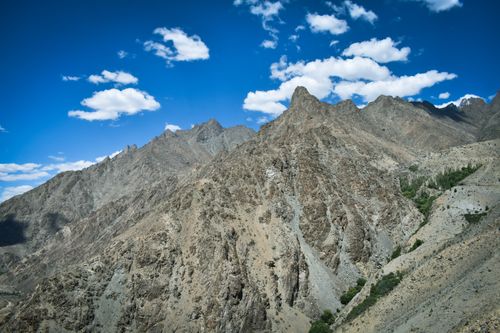 Free Majestic view of rocky mountain peaks under a vibrant blue sky. Stock Photo
