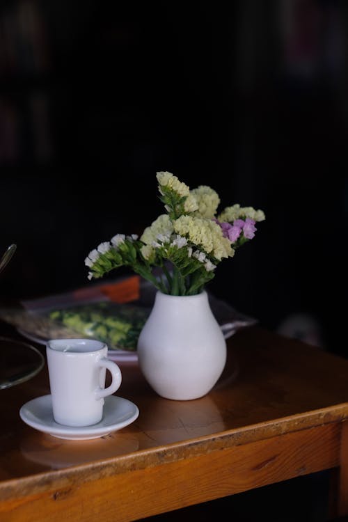 Flowers in a Vase and White China