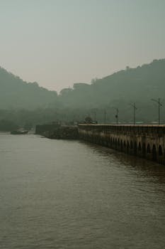 Discover the misty atmosphere and tranquil waters at Elephanta Island, Mumbai.