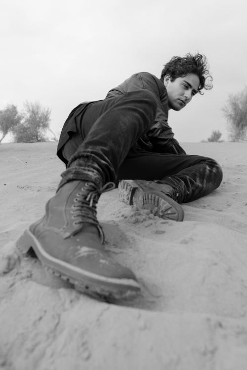 Young Man Relaxing on Sand