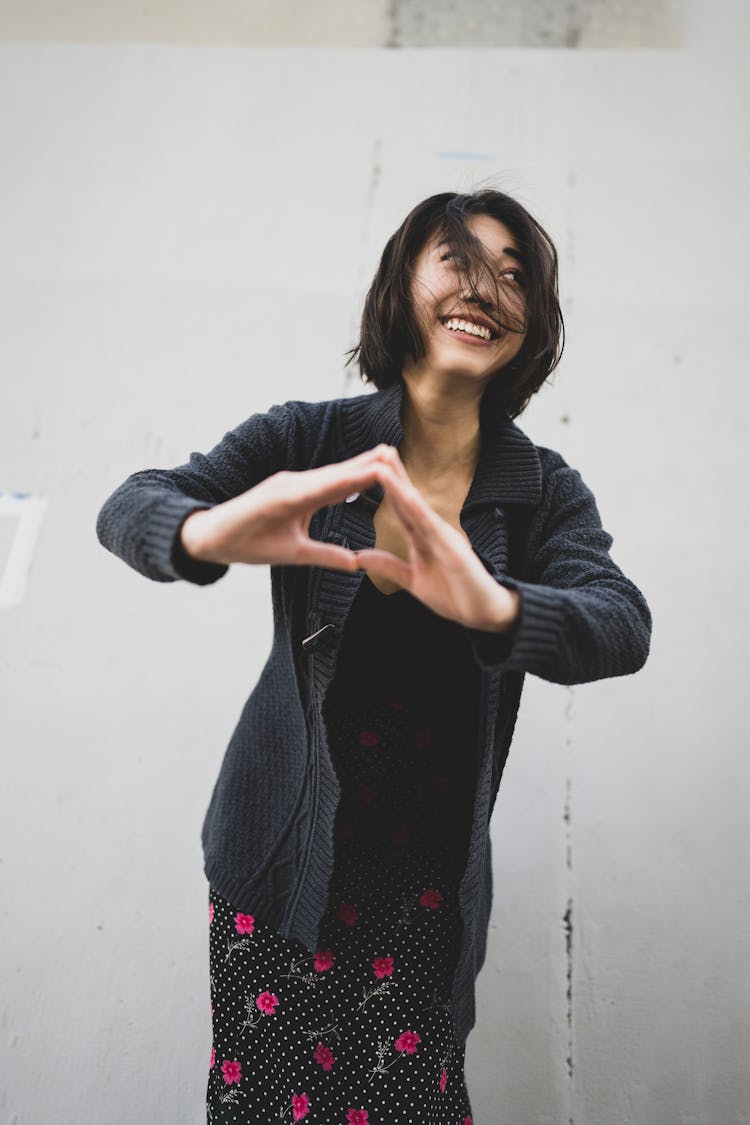 Happy Brunette Woman In Cardigan