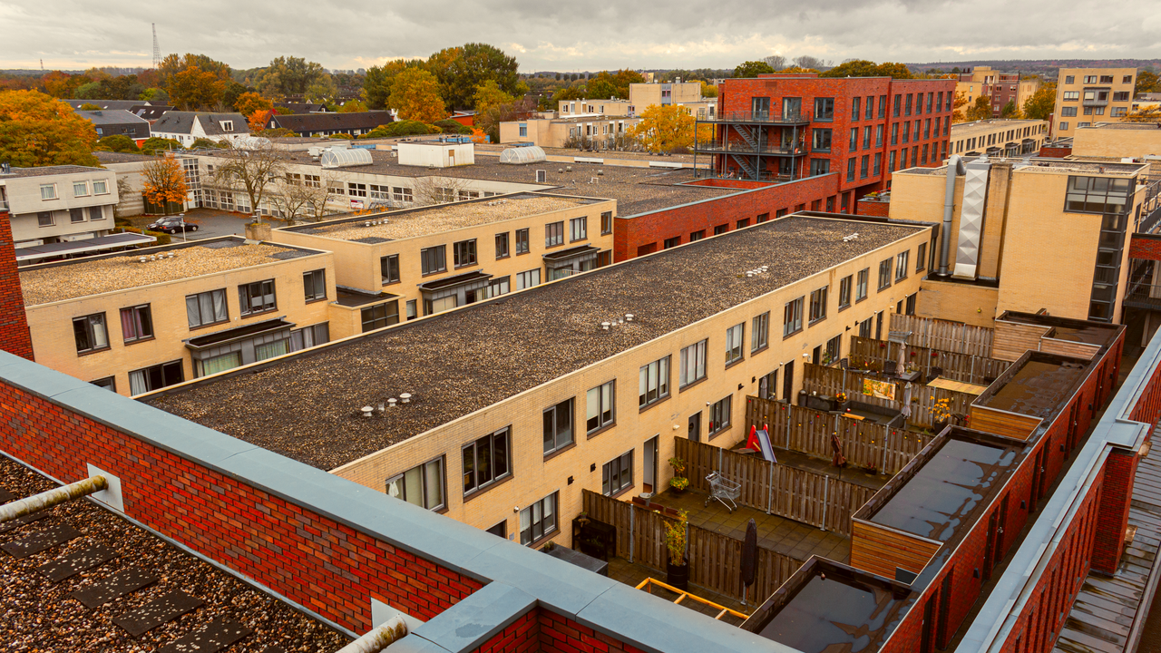 City buildings with flat gravel-covered roofs
