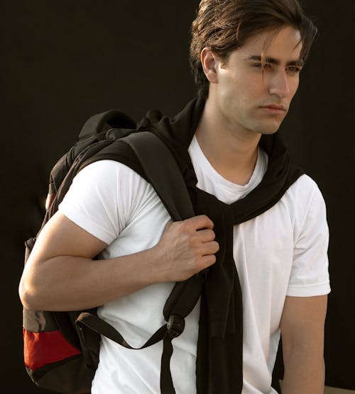Handsome Man in White T-Shirt with Backpack