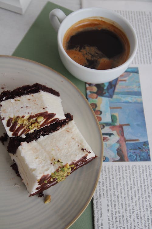 Free Cake and Coffee on Newspaper Stock Photo