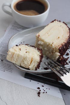 Tasty roll cake served with a cup of coffee, perfect for dessert lovers.