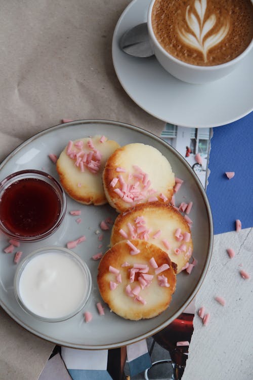 Free Cookies, Cream, Syrup and Cup of Cappuccino Stock Photo