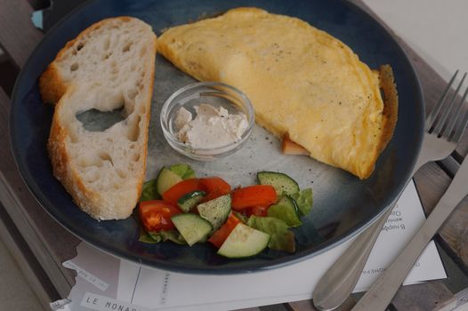 Photo of an Omelette and Salad on a Plate