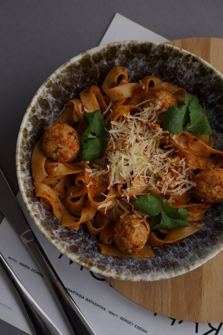 A Bowl Of Pasta With Meatballs