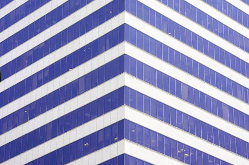 Angle modern business building skyscraper blue glass windows. Windows of facade