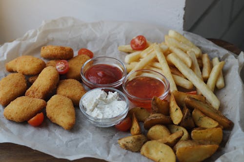 Photo of Nuggets with French Fries and Sauce Bowls