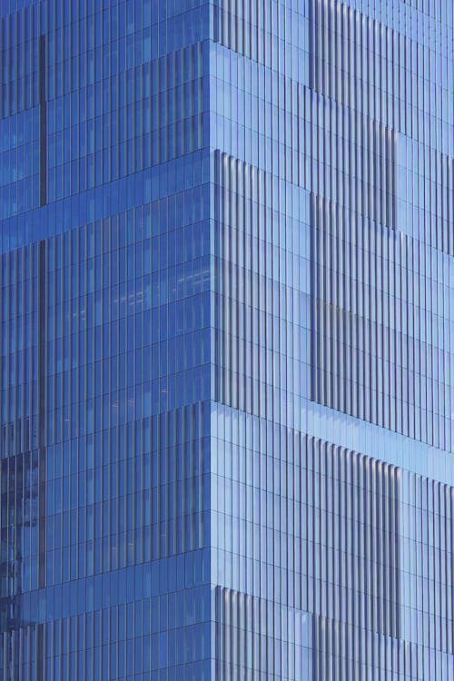 Angle modern business building skyscraper blue glass windows
