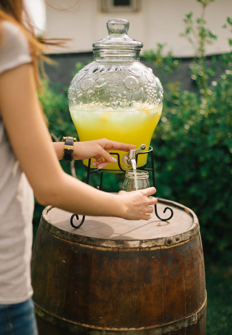 Woman Pouring Fresh Juice