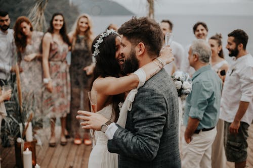 Wedding Guests Watching the Bride and Groom during Their First Dance 