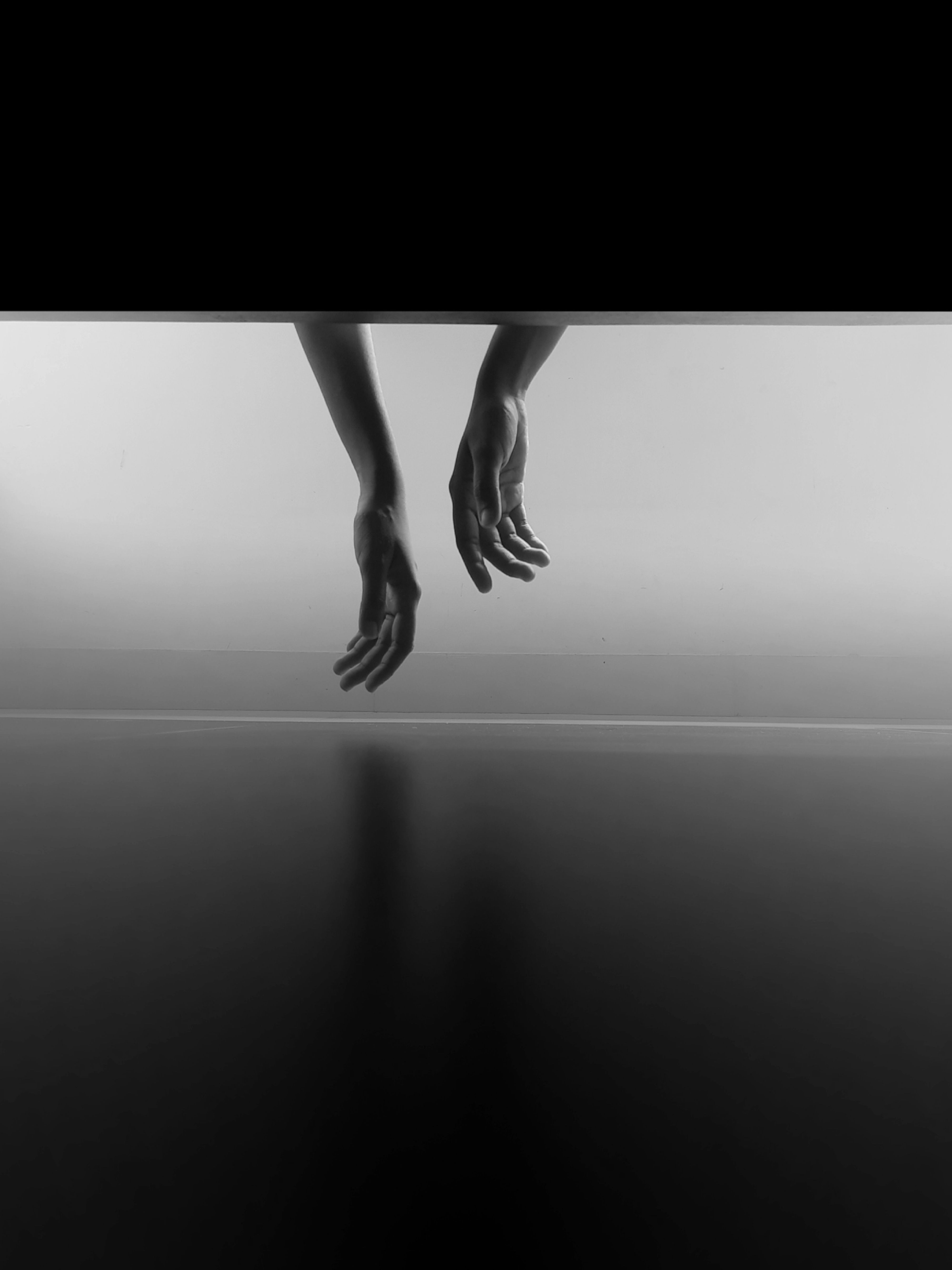 A black and white photo of a person's hands · Free Stock Photo