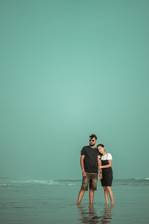 Couple Hugging Standing in Water