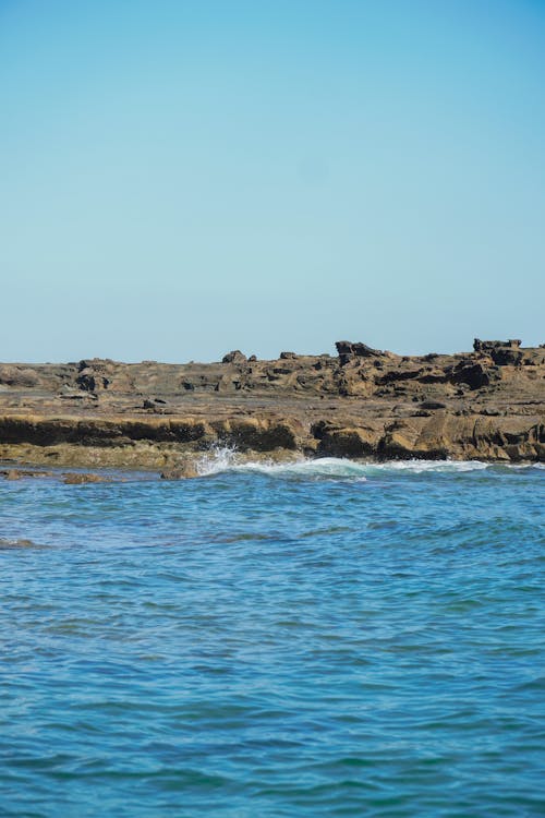 Water Splashing on Rocks on Seashore