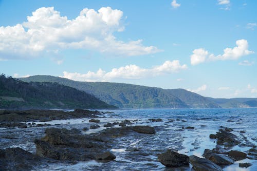 Rocks in Water in Mountains Landscape