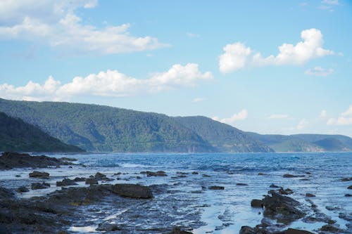 Free Rocks in Sea in Mountains Landscape Stock Photo