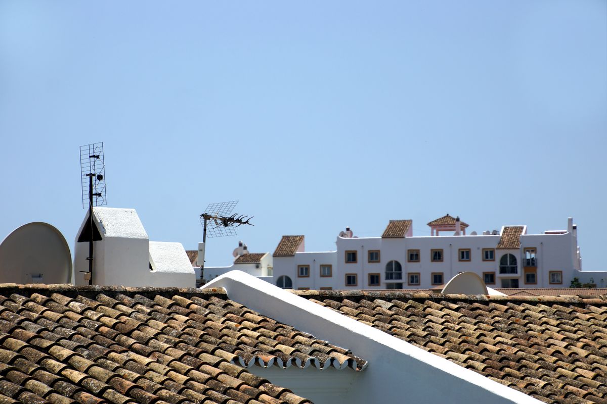 Roofing built for Madera's environment – sunlit tiled rooftops