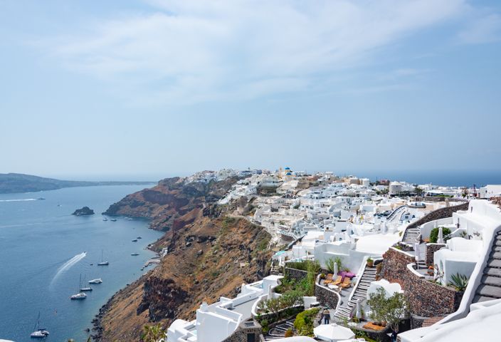 Picturesque view of Santorini's white architecture along the blue Aegean Sea.