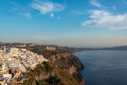 Breathtaking view of whitewashed buildings overlooking the Aegean Sea in Santorini, Greece.