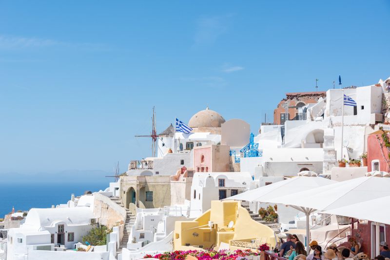 Beautiful townscape on Santorini Island with white buildings and blue sky in summer.