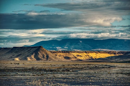 Brown Mountain Under Gray Clouds