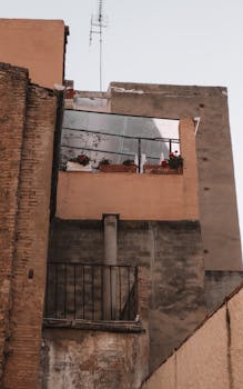 Charming urban balcony with flowers in Castellón de la Plana, Spain.