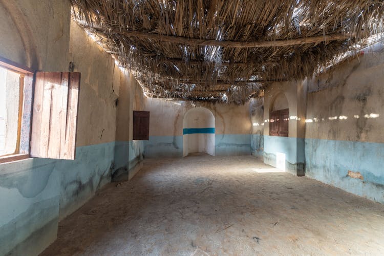 Empty Room In Abandoned House With Straw Roof