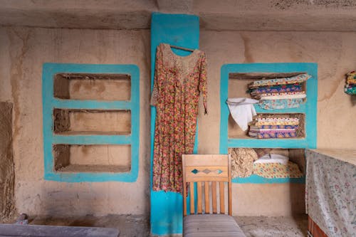 Retro Dress Hanging on Wall in Abandoned House