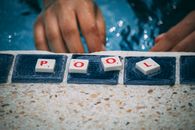 Person Playing Scrabble