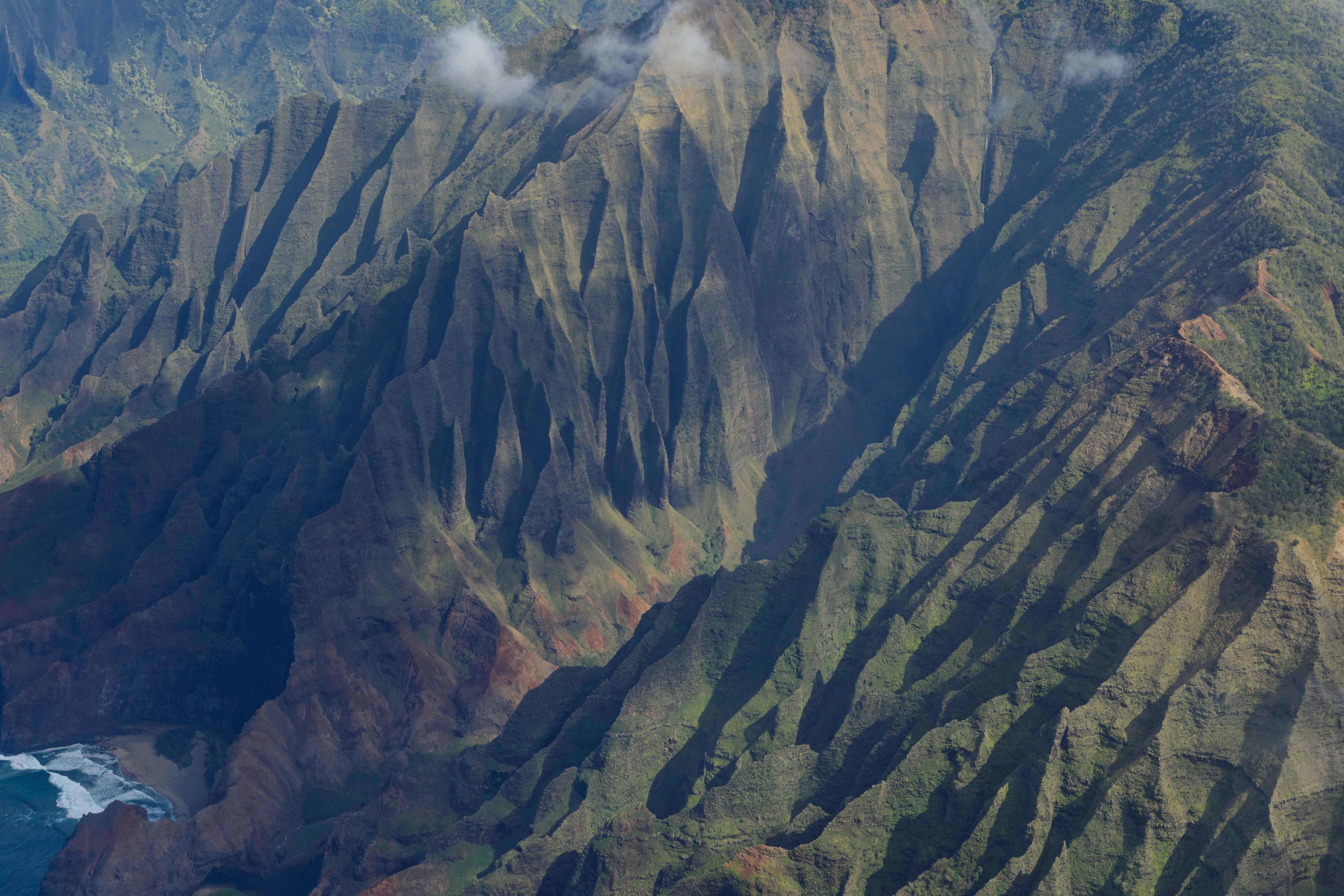 Stunning Volcano Adventure: Hilo Sightseeing w/ Optional Helicopter Tour Review Review 2026 - Stunning aerial shot of the rugged Na Pali coast in Kauai featuring dramatic cliffs.
