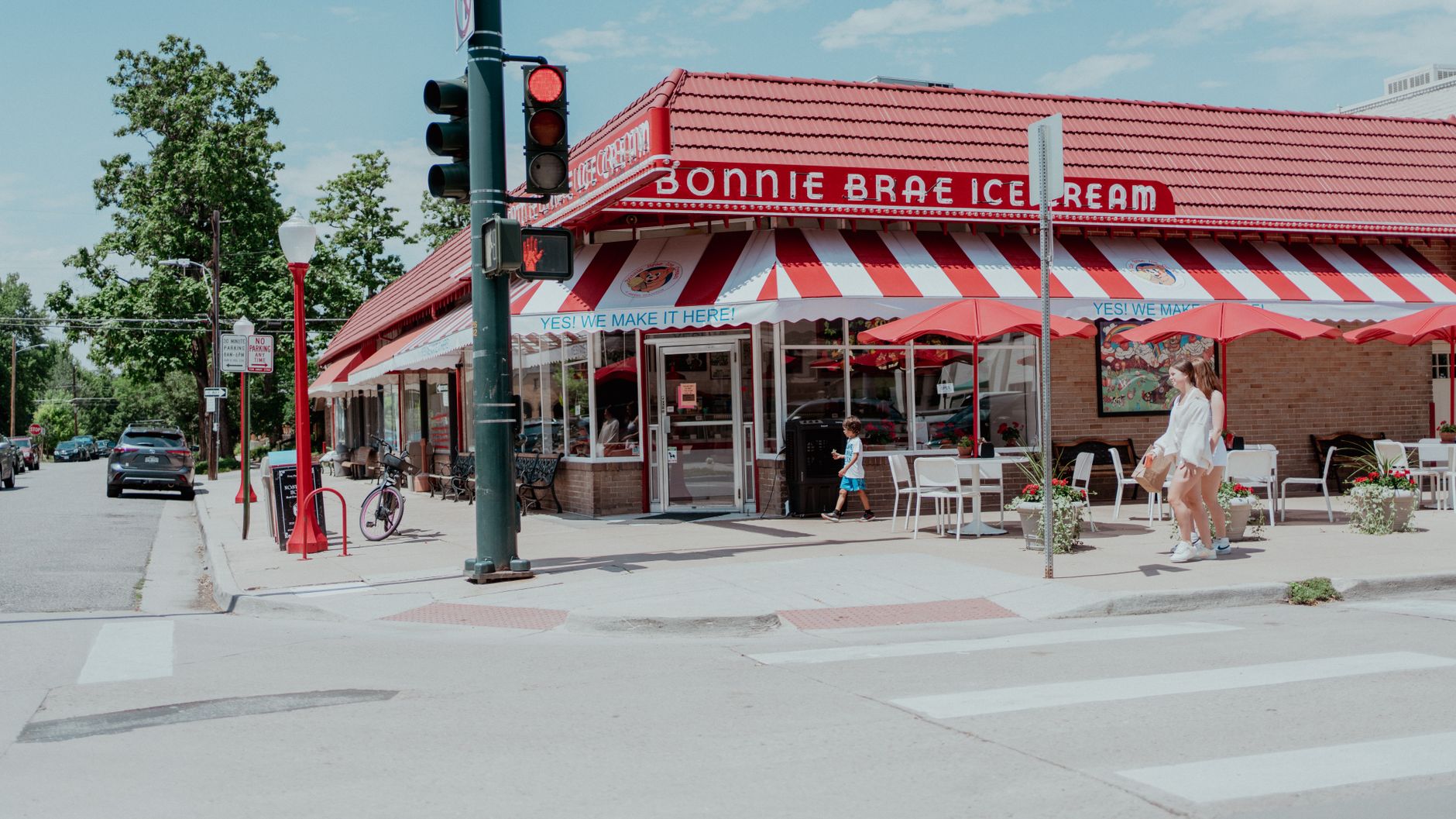 Charming street view of Bonnie Brae Ice Cream in Denver, featuring a lively outdoor scene.