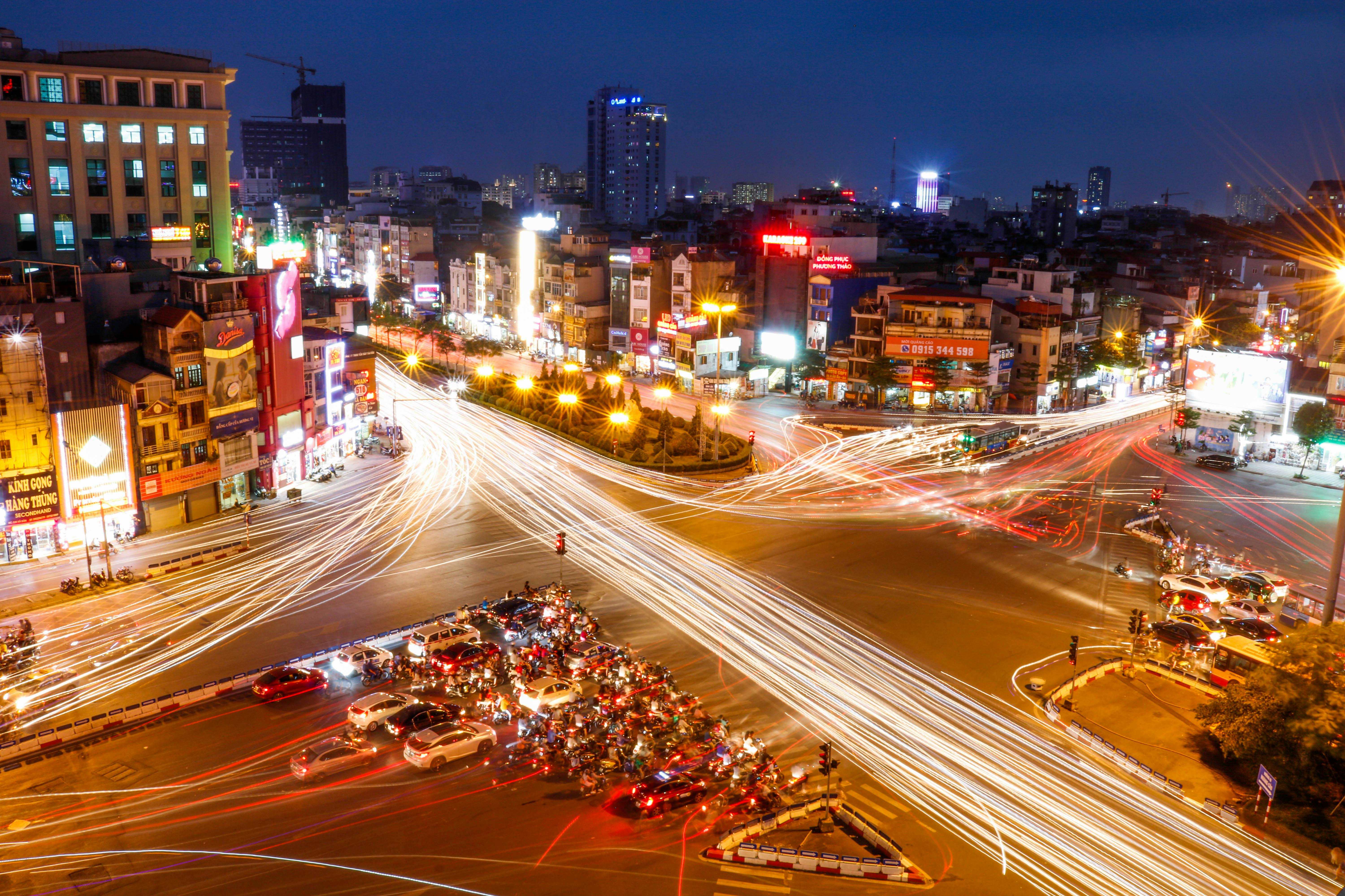 time lapse photography of vehicles crossing the intersection