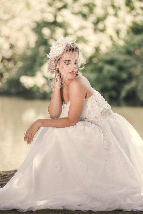 Woman in a Wedding Dress Looking to Her Side