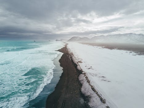 A breathtaking aerial view of a winter beach and mountains in Kamchatka, Russia.